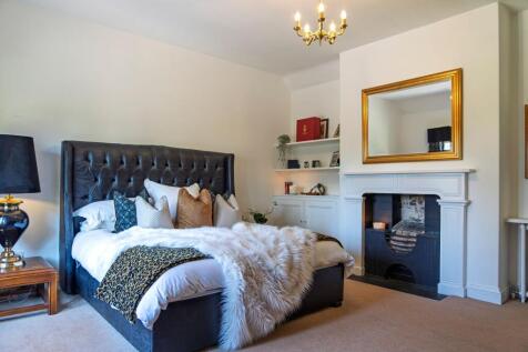 Master Bedroom with feature fireplace and fitted storage