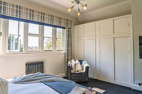 Fitted storage in the third bedroom