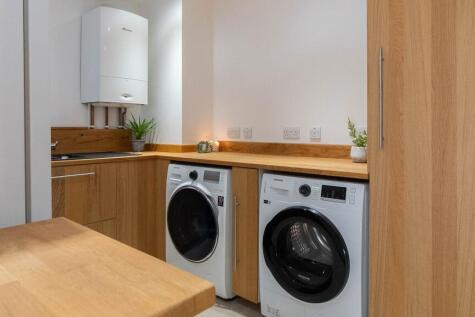 large utility with plumbing for washer and dryer