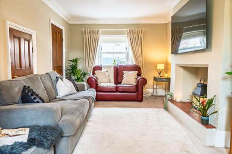 The sitting room with fitted storage