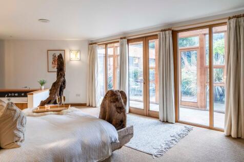 Principal Suite with views out over the lush grounds
