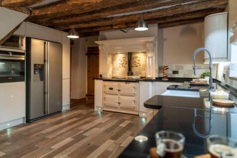 Large kitchen with exposed beams