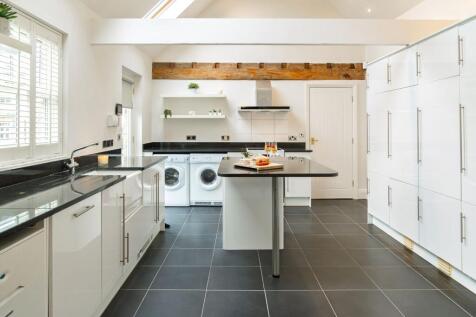 Annexe kitchen with ample storage and worktop space