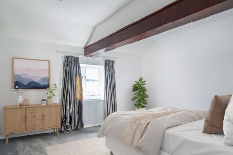 Bedroom 3 with exposed beams brimming with character