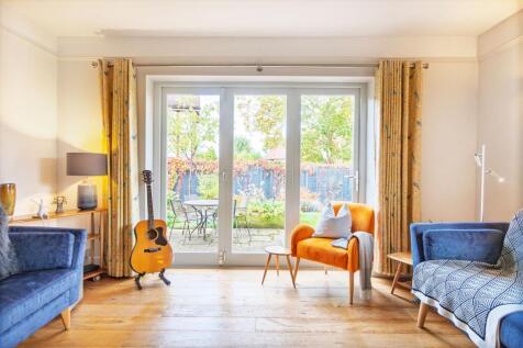 Large lounge with bi-folds doors onto the West facing garden
