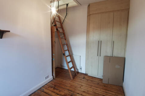 Bedroom Two, Ladders Leading To Attic