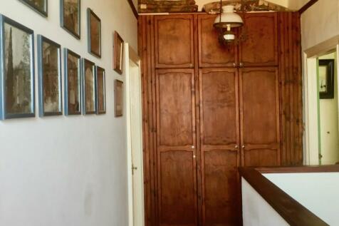 Hallway second floor leading to two bedrooms and a bathroom 