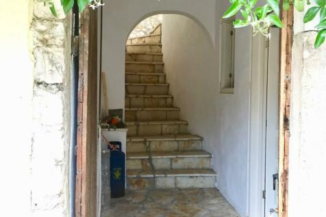 Staircase leading to a bedroom, an outside area and a music room 