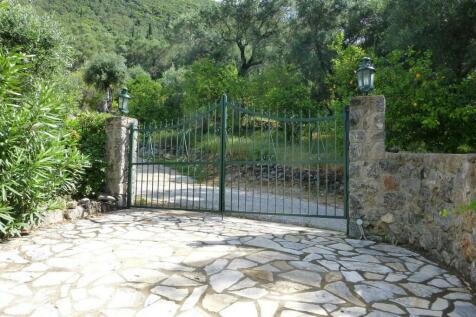 Gated parking area next to the villa