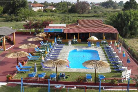 aerial view of pool and buildings