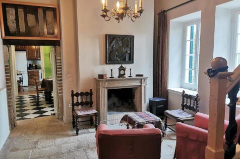 sitting room leading to dining and kitchen