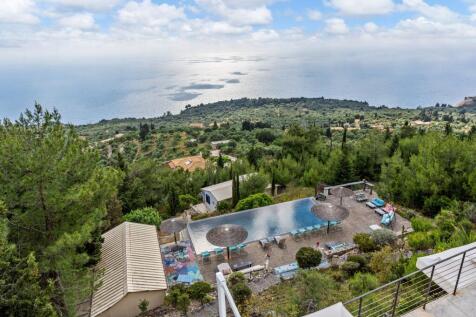aerial view of hotel, olive groves and sea