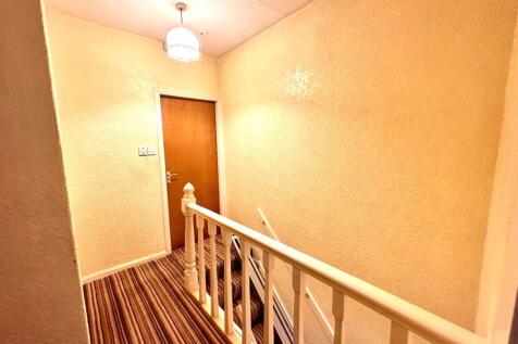 TO THE FIRST FLOOR LANDING