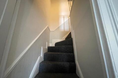 TO THE FIRST FLOOR LANDING