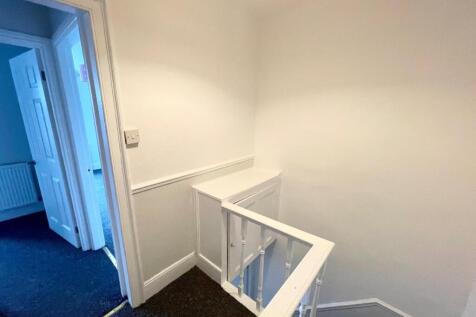 TO THE FIRST FLOOR LANDING