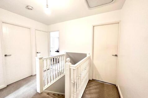 STAIRCASE RISES TO FIRST FLOOR