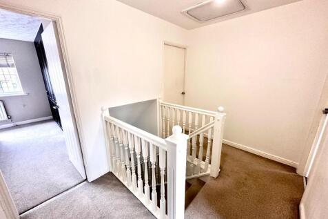 STAIRCASE RISES TO FIRST FLOOR