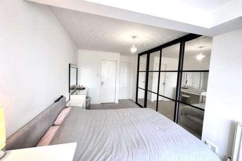 PRIMARY BEDROOM WITH EN-SUITE