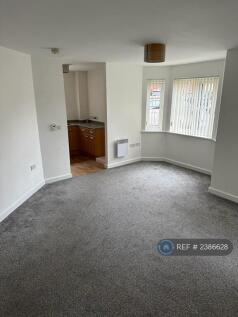 Living Area Leading Into Kitchen