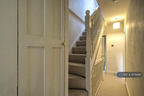 Hallway With Staircase To Attic Room