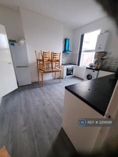 Large Kitchen With Dinner Table And Chairs.