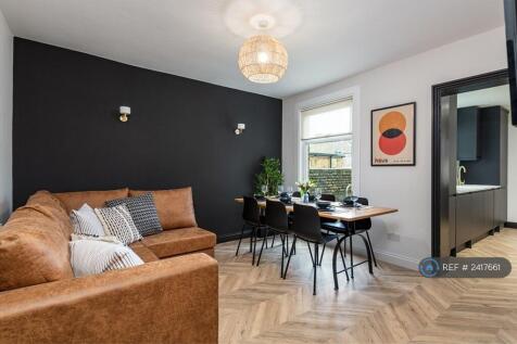 Living And Dining Room With Large Tv