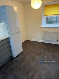 Fridge/Freezer And Dining Area