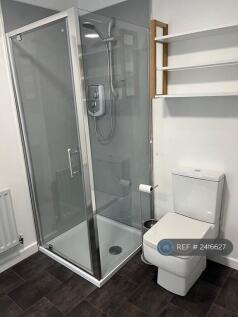Shower And Toilet In Bathroom