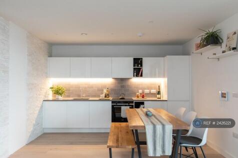 Open Plan Kitchen Area With Stone Feature Wall