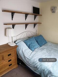 Shelves Above Bed And Storage Under.