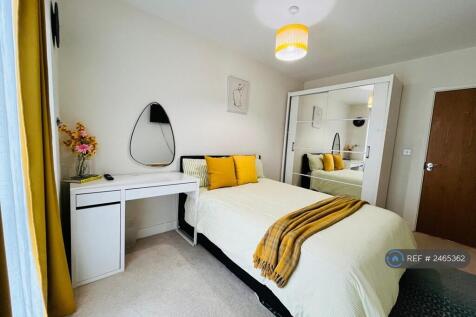 Bedroom With View Of Balcony &amp; Garden