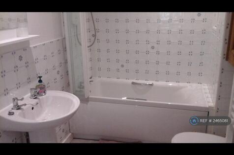 Bathroom With Electric Shower Over Bath