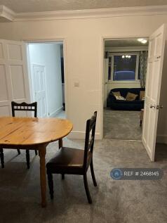 Dining With Access To Living Room And Hallway