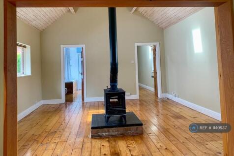 Living Room With Central Wood Burning Stove