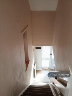 Looking Downstairs Towards The Front Door