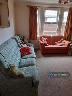 Two Sofas And a Chair In Sitting Room
