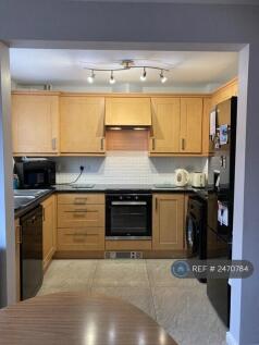 Kitchen With Fridge Freezer And Washing Machine