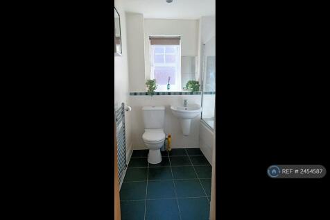 Bathroom With White Fixtures And Fittings