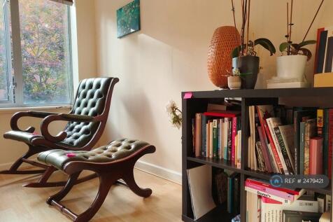 Storage And Reading Chairs In Bedroom