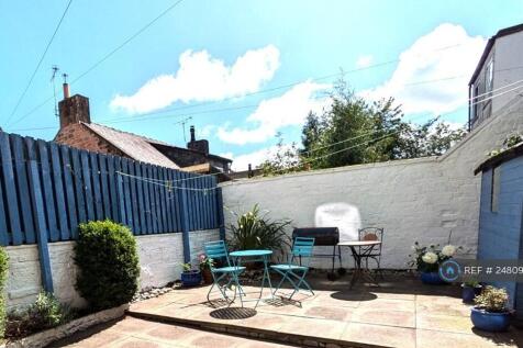 Sunny Yard With Bike Shed