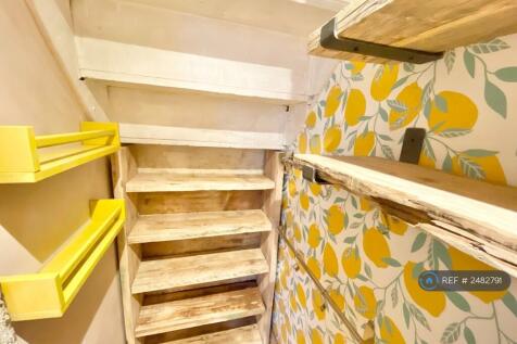 Storage Under The Stairs By The Kitchen