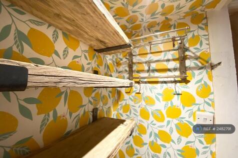 Storage Under The Stairs By The Kitchen