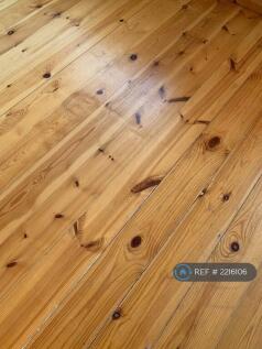 Wooden Flooring Throughout