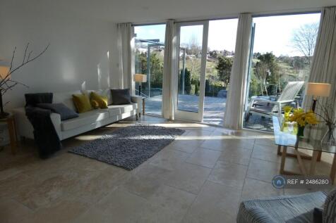 Living Room Leading To Front Patio/Balcony Area