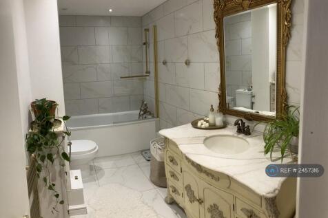 Large Bathroom With Vintage Bathtub