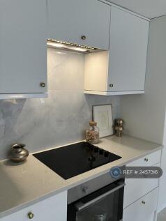 Kitchen With Cararra Marble Counter Top