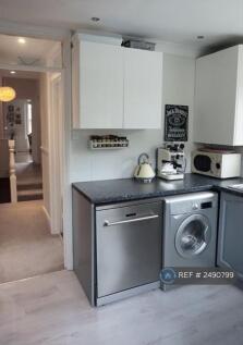 Kitchen With Fridge/Freezer And Washing Machine
