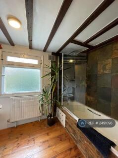 Bathroom With Waterfall Shower And Bath
