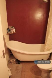 Bathroom With Shower And Roll Top Bath