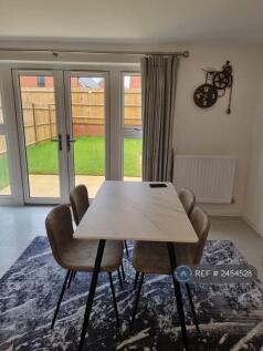 Living Room With Dining Table And Sofa